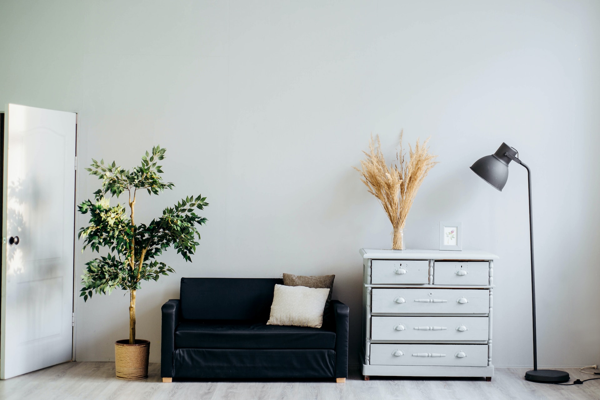 Sleek dresser alongside sofa