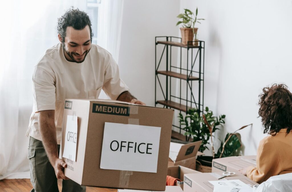 a person is moving office items